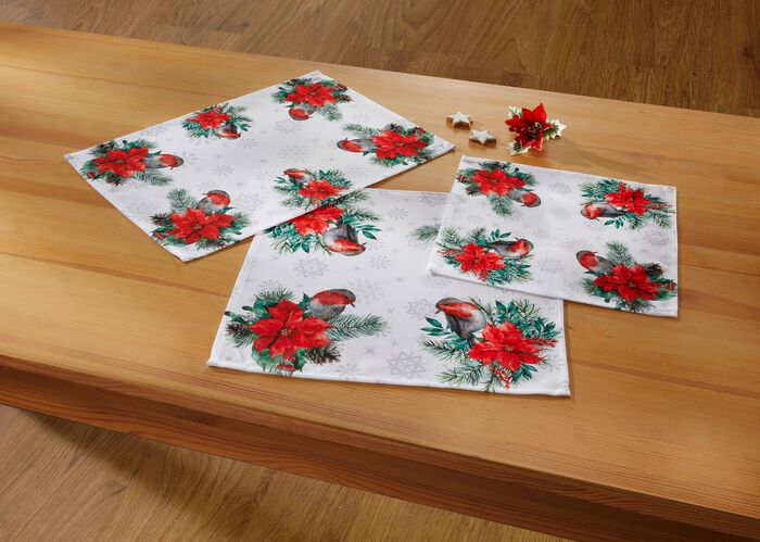 Tisch- und Raumdekoration mit niedlichen Rotkehlchen 