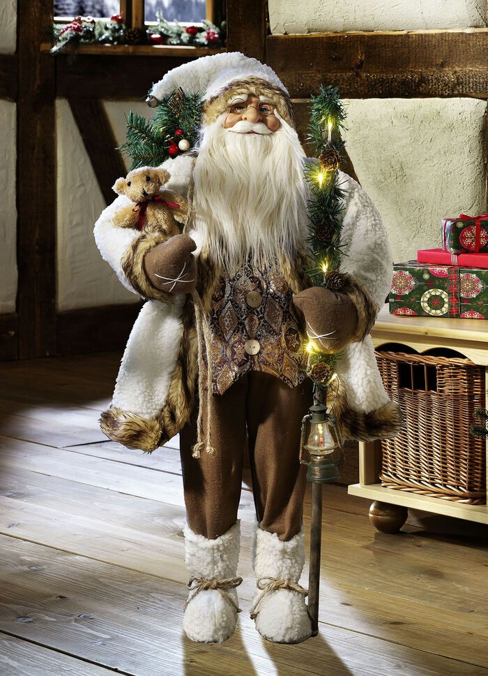 Weihnachtsmann mit beleuchtetem Wanderstock